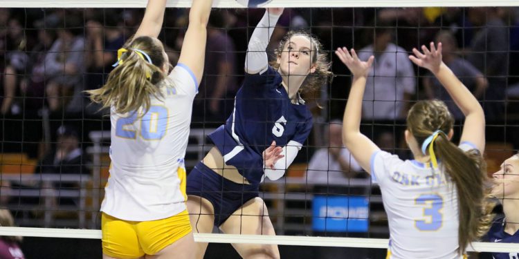 (Brad Davis/For LootPress) Shady Spring's Chloe Thompson attacks as Oak Glen's McKenzi Martin, left, and Makayla Zoellers defend during semifinal action at the State High School Volleyball Tournament Friday night at the Charleston Civic Center.