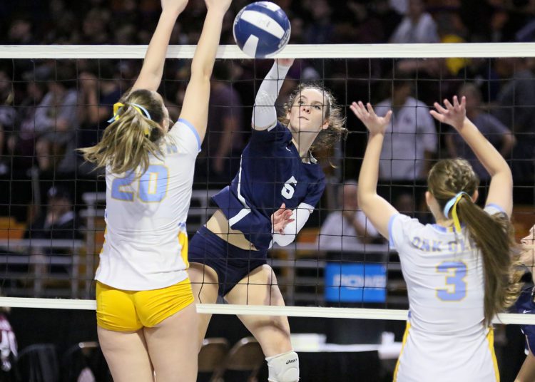 (Brad Davis/For LootPress) Shady Spring's Chloe Thompson attacks as Oak Glen's McKenzi Martin, left, and Makayla Zoellers defend during semifinal action at the State High School Volleyball Tournament Friday night at the Charleston Civic Center.