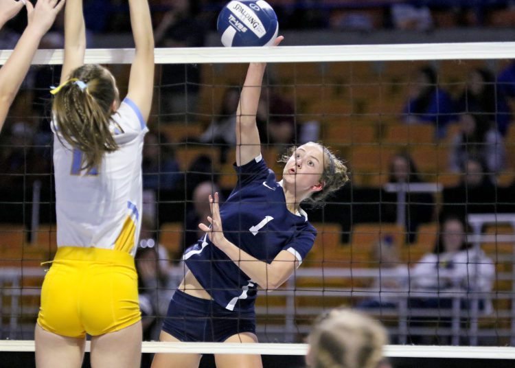 (Brad Davis/For LootPress) Shady Spring's Camille Testerman attacks as Oak Glen's Emma Renfro defends during semifinal action at the State High School Volleyball Tournament Friday night at the Charleston Civic Center.