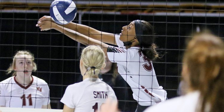 (Brad Davis/For LootPress) Woodrow Wilson's Zamahiya Moss reaches to return a ball during the Flying Eagles' first round matchup with George Washington at the State High School Volleyball Tournament last November at the Charleston Civic Center.