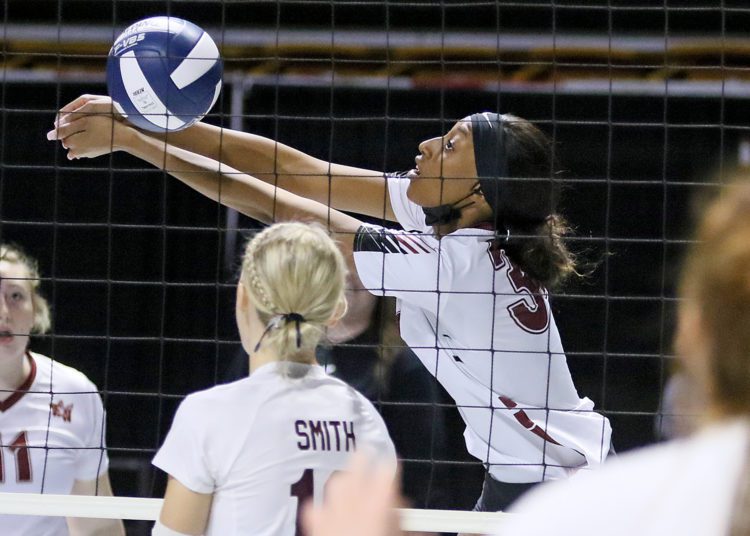 (Brad Davis/For LootPress) Woodrow Wilson's Zamahiya Moss reaches to return a ball during the Flying Eagles' first round matchup with George Washington at the State High School Volleyball Tournament last November at the Charleston Civic Center.