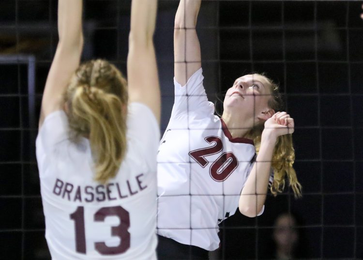(Brad Davis/For LootPress) Woodrow Wilson's Emily Stack attacks as George Washington's Delaney Brasselle defends during first round action at the State High School Volleyball Tournament Friday morning at the Charleston Civic Center.