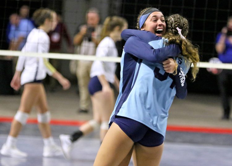 (Brad Davis/For LootPress) Philip Barbour players Averi Carpenter, left, and Katie Kennedy embrace in celebration after defeating Shady Spring to win the Class AA State Championship Saturday morning at the Charleston Civic Center.