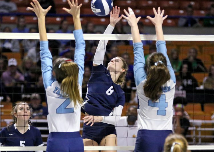 (Brad Davis/For LootPress) Shady Spring's Peydon Smith attacks as Frankfort's Jaci Rowe, right, and Taylor Mandell defend during first round action at the State High School Volleyball Tournament Friday morning at the Charleston Civic Center.