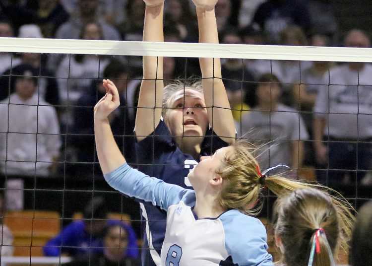 (Brad Davis/For LootPress) Shady Spring's Meg Williams blocks an attack from Frankfort's Reagan Dyson during first round action at the State High School Volleyball Tournament Friday morning at the Charleston Civic Center.