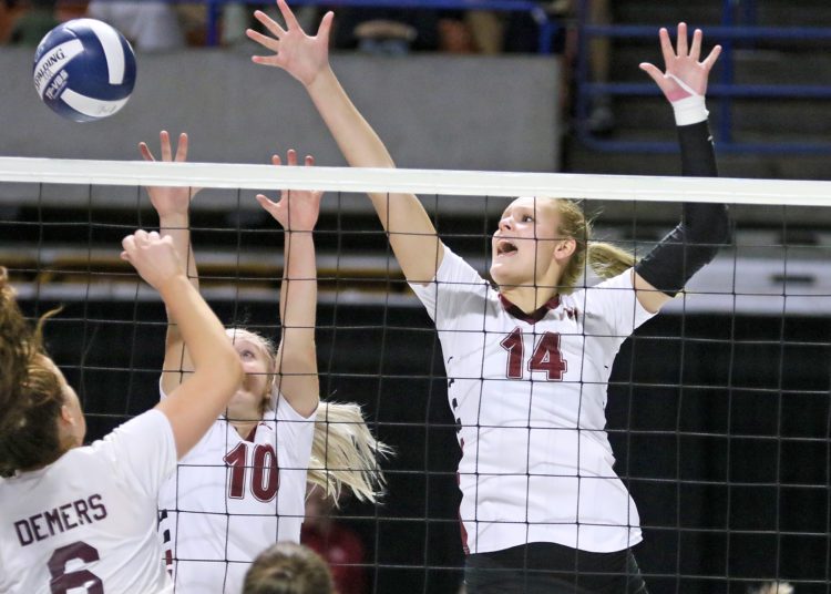 (Brad Davis/For LootPress) Woodrow Wilson's Olivia Ziolkowski, right, contests a ball at the net during the Flying Eagles' first round matchup with George Washington at the State High School Volleyball Tournament Friday morning at the Charleston Civic Center.