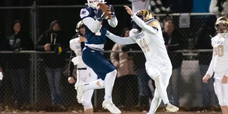 Independence's Trey Bowers intercepts a pass on Friday, Nov. 12 in the team's first-round playoff game against Shady Spring. (Heather Belcher/Lootpress).