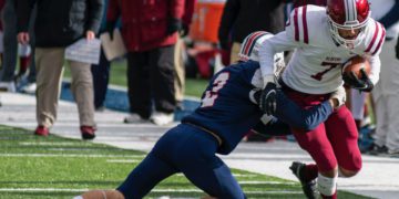 Independence's Cyrus Goodson tackles Bluefield's Jacorian Green during their Class AA semifinal game Friday Nov. 26 in Coal City. (Heather Belcher/Lootpress)