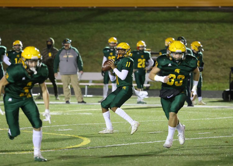 Greenbrier East’s quarterback Monquelle Davis (11) looks to pass during their high school football game against George Washington in Fairlea on Friday, Nov. 12, 2021 (Photo by Chris Jackson)
