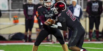 File Photo by Greg Barnett
Bluefield's Ryker hands the ball off to Amir Hairston during a game against Mingo Central on Nov. 5