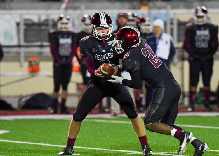 File Photo by Greg Barnett
Bluefield's Ryker hands the ball off to Amir Hairston during a game against Mingo Central on Nov. 5