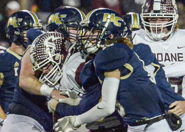The Nicholas County defense stops Roane County’s Briar Begler in his tracks during Friday action in Summersville. (F. Brian Ferguson/Lootpress)