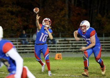 Midland Trail’s Joshua Dickerson (10) attempts a pass during their high school football game against Pocahontas County in Hico on Friday, Nov. 5, 2021 (Photo by Chris Jackson)