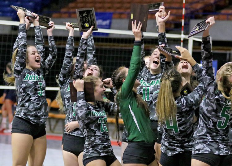 (Brad Davis/For LootPress) Musselman players celebrate with their new hardware after defeating Hedgesville to win the Class AAA State Championship Saturday evening at the Charleston Civic Center.