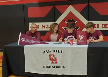 Oak Hill's Jack Hayes signs his LOI to play golf at Fairmont State Wednesday afternoon at Oak Hill High School.