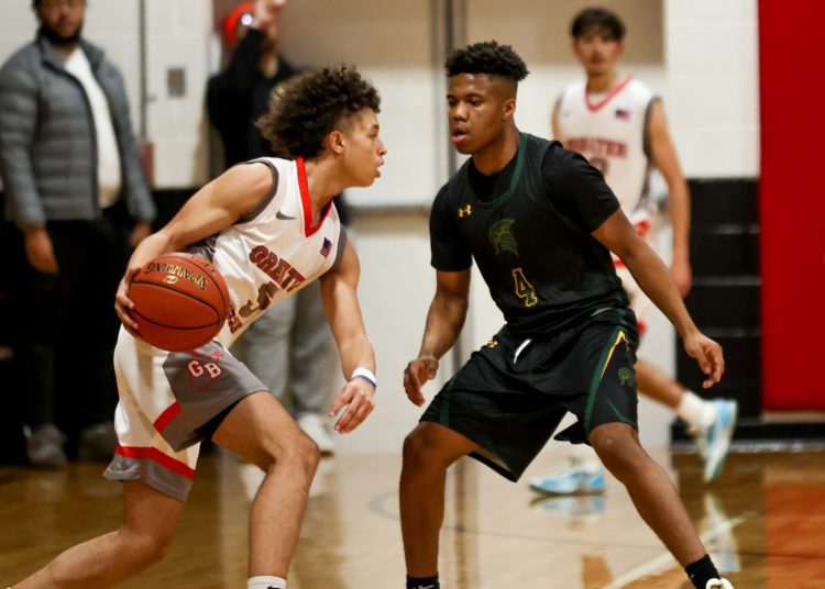 Greater Beckley's Kaden Smallwood (left) looks to drive past Greenbrier East's Monquelle Davis during. a game on Dec. 21 (Karen Akers/Lootpress)