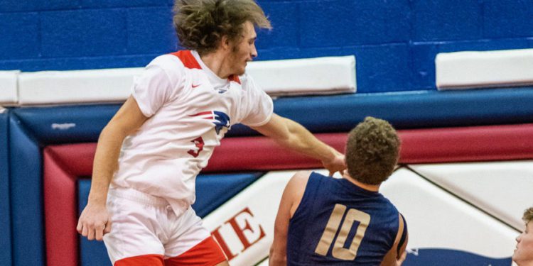 Independence's Cyrus Goodson defends a shot in the lane during. game against Greenbrier West on Dec. 23 in Coal City 

(File Photo/Heather Belcher)