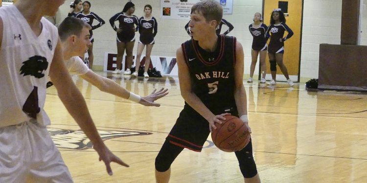 Oak Hill's Sammy Crist jab steps during a game against Bluefield on Dec. 14.