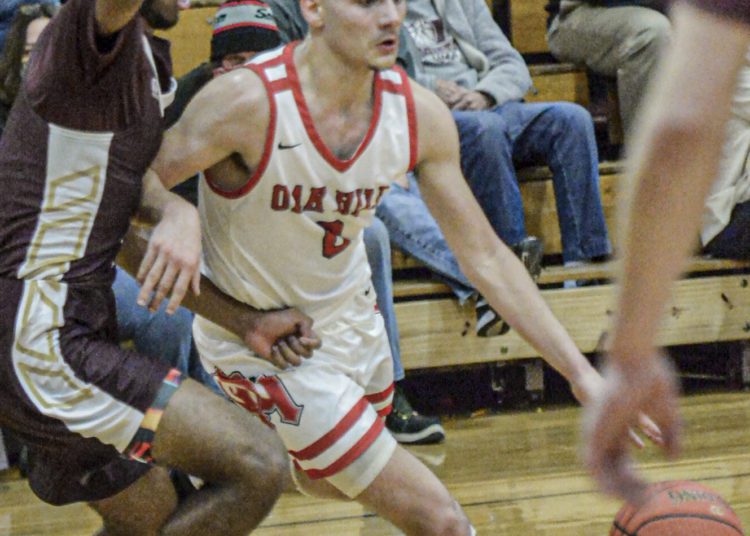 Oak Hill’s Jacob Perdue drives against GW during Friday action in Oak Hill. (F. Brian Ferguson/Lootpress)