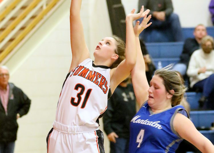 (Brad Davis/For The LootPress) Summers County's Jessi Ward drives to the basket Montcalm's Jaden Lambert defends during Friday action at the Rogers Oil Classic in Hinton.