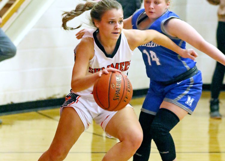 (Brad Davis/For The LootPress) Summers County's Liv Meador drives around Montcalm's Hayley Hendrick during Friday action at the Rogers Oil Classic in Hinton.