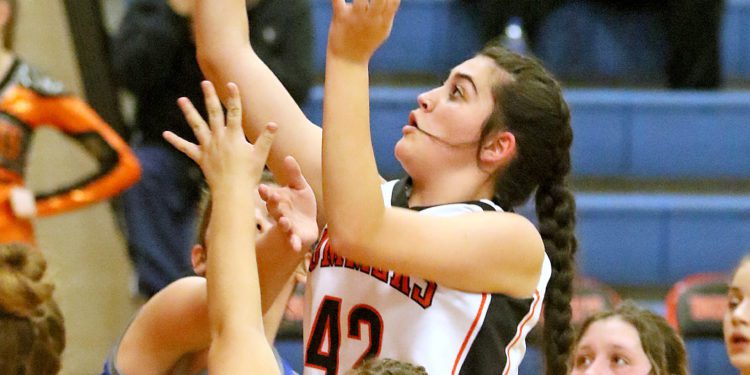 (Brad Davis/For The LootPress) Summers County's Gracie Harvey drives and scores against Montcalm on Dec. 10 at the Rogers Oil Classic in Hinton.
