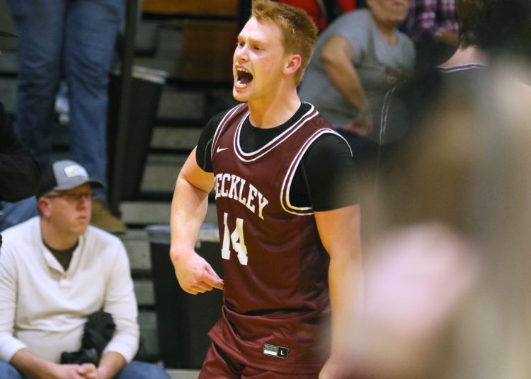 (Brad Davis/For LootPress) Woodrow Wilson's Maddex McMillen skips around the court in celebration after his late three-pointer sank rival Greenbrier East Friday night in Fairlea.