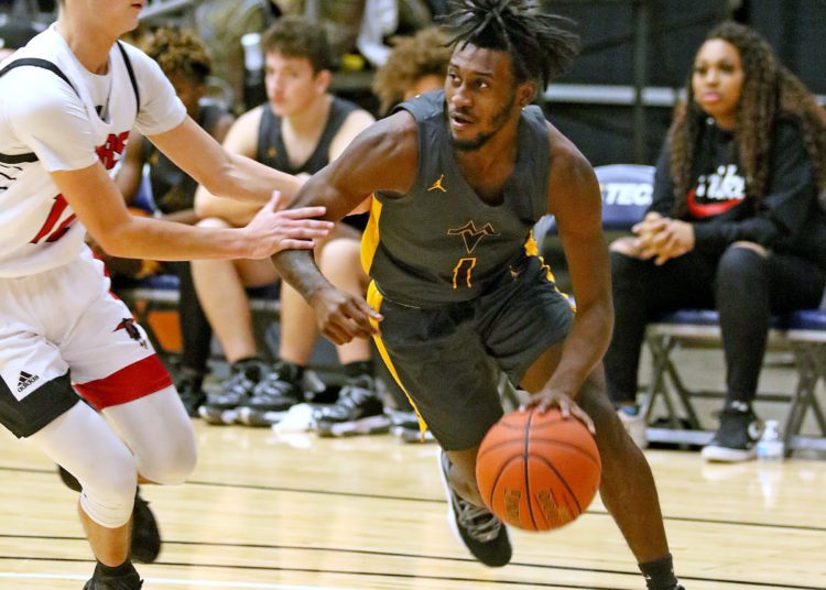 (Brad Davis/For LootPress) Mount View's Tony Bailey drives to the basket against Liberty during New River Invitational action Wednesday night in Beckley.