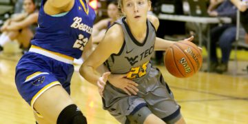 (Brad Davis/For LootPress) WVU Tech's Brittney Justice drives to the basket as Brescia's Hallie Fisher defends Saturday afternoon in Summersville.
