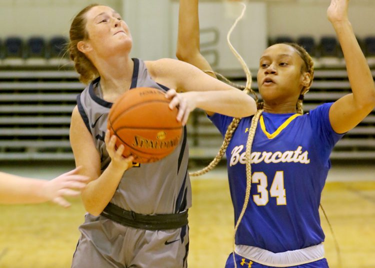 (Brad Davis/For LootPress) WVU Tech's Emilee Whitt drives to the basket as Brescia's Jacqueline Jackson defends Saturday afternoon in Summersville.