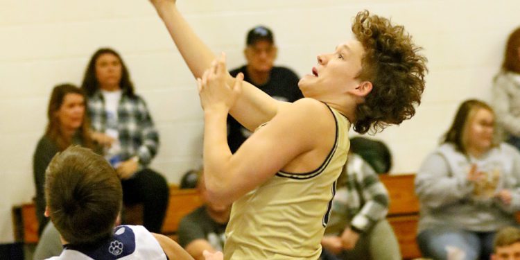 (Brad Davis/For LootPress) Greenbrier West's Brayden McClung drives to the basket as Meadow Bridge's Conner Mullins defends January 21, 2022.