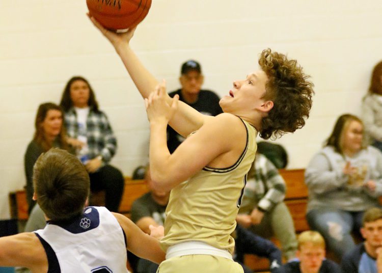 (Brad Davis/For LootPress) Greenbrier West's Brayden McClung drives to the basket as Meadow Bridge's Conner Mullins defends January 21, 2022.