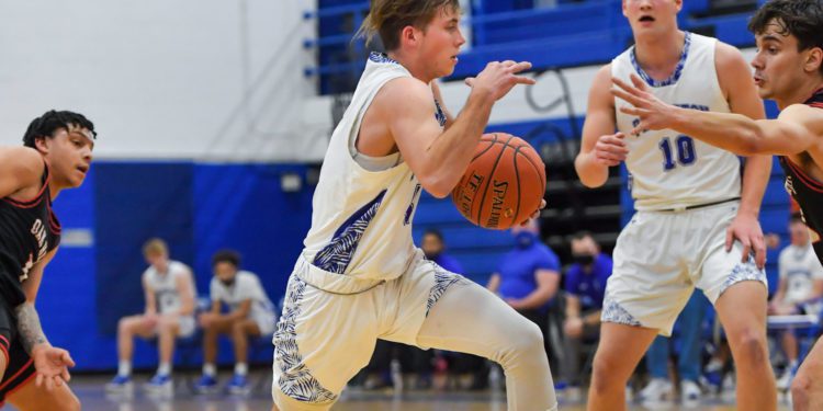 Princeton's Chase Hancock drives to basket during a game against Oak Hill last season 
(File Photo by Greg Barnett)