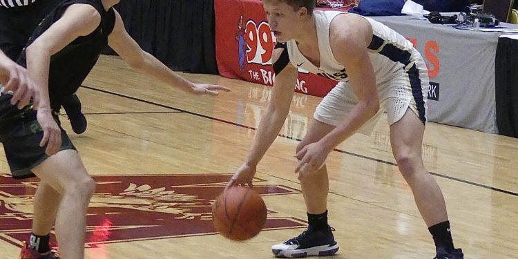 File Photo - Greenbrier West's Chase McClung sizes up a defender during a game against Greenbrier Eats on Jan. 8