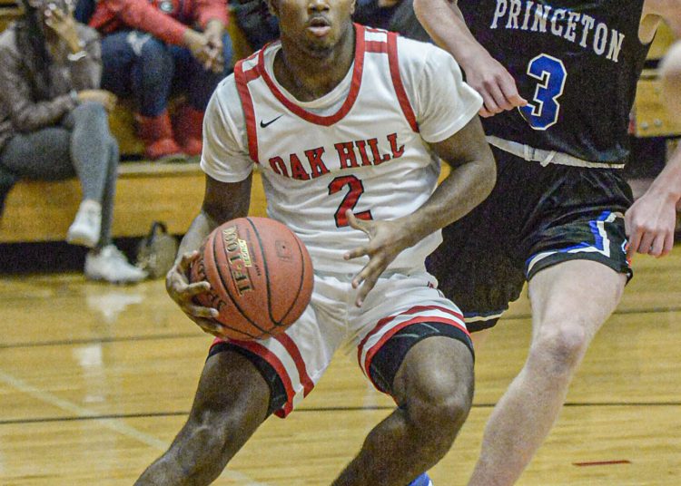 Oak Hill’s Leonard Farrow, left, elbows his way in the lane against Princeton’s Aiden Ash during Tuesday action in Oak Hill. F. Brian Ferguson/Lootpress
