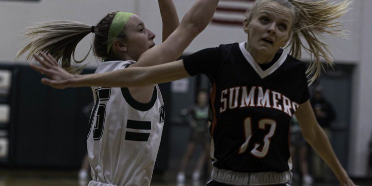 Summers County's Sullivan Pivont closes out on Wyoming East's Maddie Clark during a game in New Richmond on Jan. 27 (File Photo/Tina Laney)
