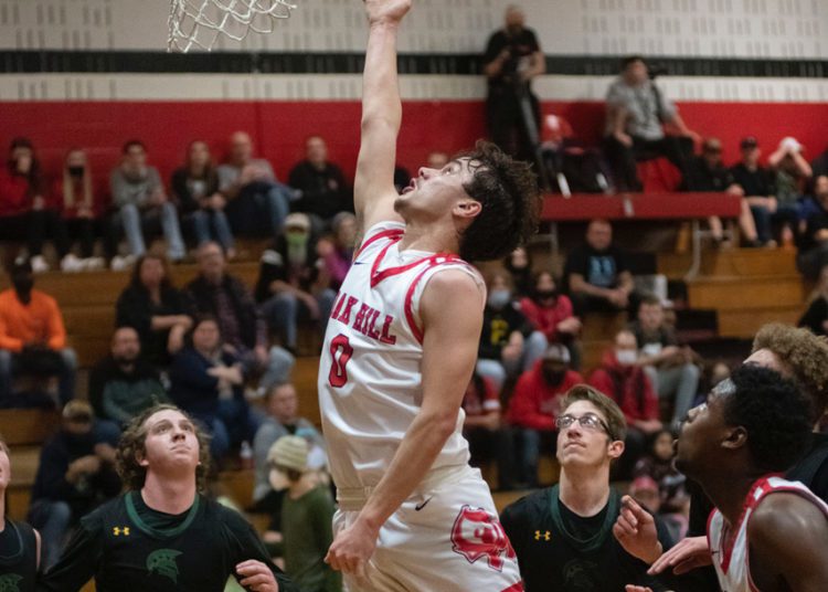 Oak Hill's Jacob Perdue drives to the bucket in a game against Greenbrier East on Feb. 16 (Heather Belcher)