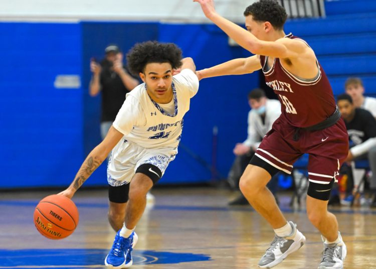 File Photo by Greg Barnett 

Princeton's EJ Washington drives up the court during a game against Beckley on Feb. 2