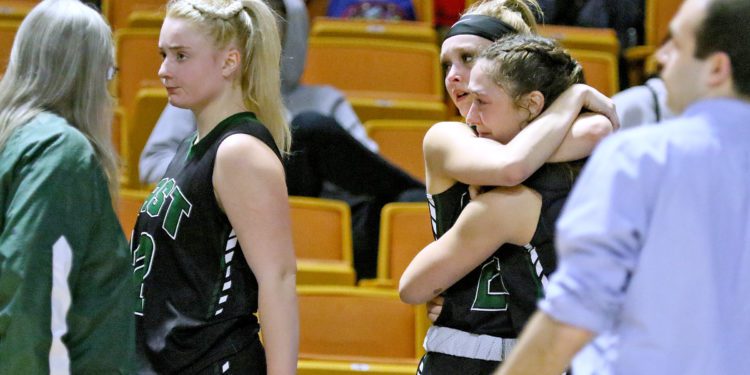 Wyoming East's Kayley Bane hugs teammate Colleen Lookabill during the Class AA state championship game at the Charleston Coliseum and Convention Center.

(Brad Davis/For LootPress) Wyoming East v Parkersburg Catholic, State Tournament Class AA Championship Game, March 12, 2022 in Charleston.