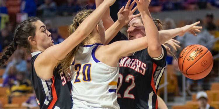 Summers County's Maggie Stover (right) and Gracie Harvey (left) defend the post in a state tournament game against St. Marys on March 9.