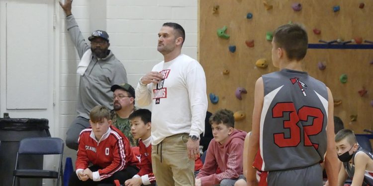 Former Oceana head coach and new Westside coach Thomas Evans directs his team from the sidelines during a game against Mullens in January.