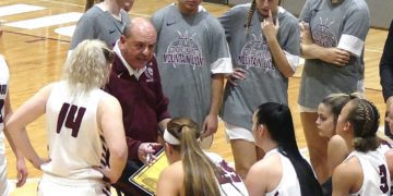 Concord Coach Kenny Osborne talk with his team during a timeout against Alderson Broaddus.