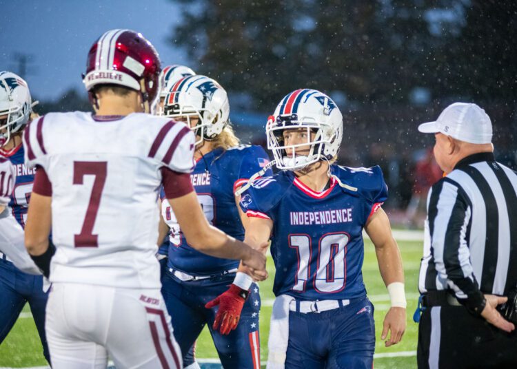 Independence RB Judah Price (right) and Bluefield QB Caleb Fuller (left) shake hands prior to their game in Coal City on Sept. 30. Each player leads the area in yards at their position.
(Photo by Heather Belcher)