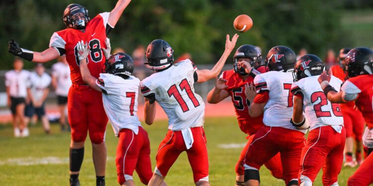 The PikeView defensive line pressures Liberty QB Dalton Williams during their game on Sept. 9 in Gardner (File Photo by Greg Barnett)