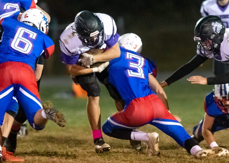 Kaden Lephew on the tackle for Midland Trail.