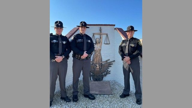 Pictured left to right:
 
Corporal Matt Doss, Deputy Tyler Cutlip and Sheriff Bruce Sloan.