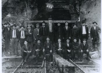 Survivors of the Layland mine explosion stand outside the mine.