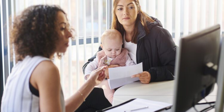 young mother with social services or housing officer