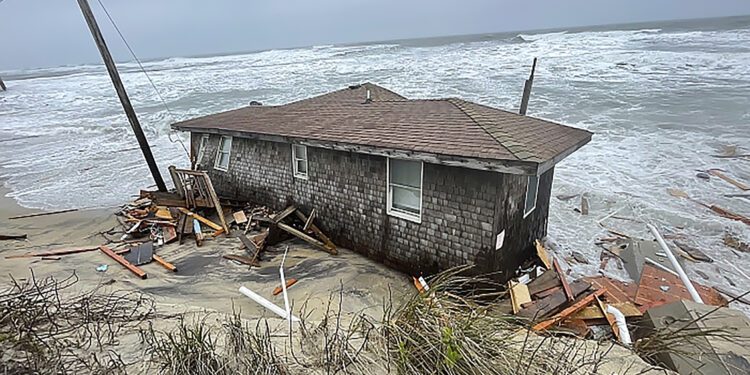 This photo provided by the National Park Service shows a collapsed one-story house in Rodanthe, N.C. (National Park Service via AP)