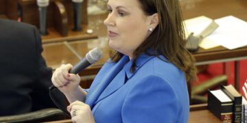 FILE - State Rep. Tricia Cotham, D-Mecklenburg, speaks on the House floor as North Carolina lawmakers gather for a special session on March 23, 2016, in Raleigh, N.C. Speculation is brewing in North Carolina that Cotham may change her party affiliation. Republicans have scheduled a news conference Wednesday, April 5, 2023, with Cotham, of Mecklenburg County. If Cotham does switch parties, the move would give the GOP complete veto-proof control of the General Assembly and hand Democratic Gov. Roy Cooper a major political setback. (AP Photo/Gerry Broome, File)